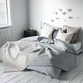 Cozy Modern Bedroom With Soft Bedding Pillows And Knitted Blanket