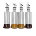White Condiment Bottles with Dispenser Tops Containing Various Colored Liquids
