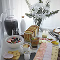 Delicious Breakfast Spread On Table With Bread Fruit Bowls Teapot Coffee Cups And Pancakes
