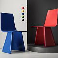 Modern Blue And Red Dining Chairs With Unique Base And Colorful Balls On Circular Platform