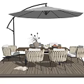 Outdoor Dining Table Setup With Wicker Chairs Patio Umbrella And Wooden Deck
