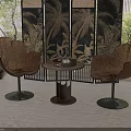Rattan Leaf Shaped Chair And Round Table Set In Natural Interior With Decorative Screen