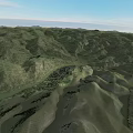 Lush Green Rolling Mountainous Garden Landscape With Natural Terrain And Blue Sky