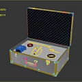 Open Silver Metal Toolbox With Black Checkered Lining And Black Device Pliers Screwdriver Round Pads