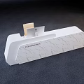 White Reception Desk With Marble Texture And Wooden Accessory Featuring Presentation Lettering 3d model