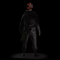 Man With Red Hair In Black Jacket And Tactical Gear Standing On Dark Background