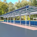 Modern Outdoor Sunshade Canopy With Metal Frame And Transparent Roof In Green Park Area