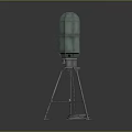 Green Cylindrical Equipment with Metal Tripod Base and Cable Nearby