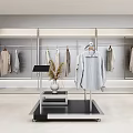 Modern Clothing Store Interior With Hanging Clothes Racks Display Stand And Potted Plants