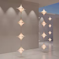 Modern Star Shaped Chandeliers Hanging In Minimalist Indoor Space With Soft Lighting