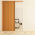 Sliding Wooden Barn Door In Modern Bedroom With White Wall And Light Colored Floor