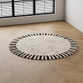 Fluffy Cream Colored Round Rug with Black Striped Border on Wooden Floor