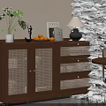 Wooden Sideboard with Rattan Doors Potted Plant Table Lamp Fruit Bowl and Books in Dining Area