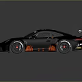 Black Porsche Race Car With Red Graphics And Yellow Manthey Rear Wing