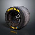 Goodyear Eagle Car Tire With Worn Appearance And Black Wheel Rim