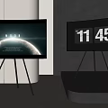 Two TVs on Tripod Stands Showing Planet Image HOME Text and 11 45 Time