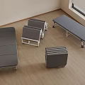 Gray Folding Beds With Metal Frames On Wooden Floor In Room With Window Blinds