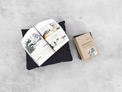 Open Magazine With Interior Design Photos On Black Pillow And Stack Of Books 3d model