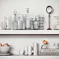 Elegant Dinnerware Set with Glassware Pieces Displayed on White Shelf and Decorative Items