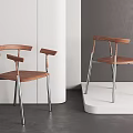 Modern Dining Chairs With Wooden Backrests And Sleek Metal Legs