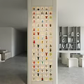 Stylish Figure Cabinet Displaying Diverse Collectible Figures On Grid Shelves Modern Living Room
