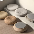 Round Woven and Linen Floor Cushions in Beige and Gray on Wooden Floor