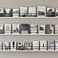 White Bookshelf With Three Shelves Neatly Arranged Black And White Cover Books