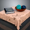 Beige Spotted Tablecloth Coffee Table With Black Book Wooden Bowl And Teal Navy Yarn Balls