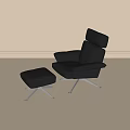 Black Leather Leisure Chair with Matching Ottoman and Metal Legs in Modern Minimalist Setting