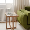 Modern Wooden Side Table With Lamp Bowl And Book By Green Sofa In Living Room