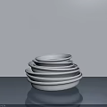 White Sculpted Ceramic Bowls Stacked in Different Sizes on Gray Surface 3d model