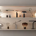 Various Modern Table Lamps With Stylish Designs Showcased On Shelves For Home Decor