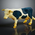 White And Blue Spotted Cow Model With Yellow Horns On Dark Surface