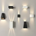 Modern Black and White Minimalist Wall Sconces on Light Colored Wall with Illumination Effects