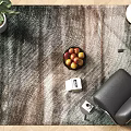 Square Rug In Modern Living Space With Potted Plant Fruit Bowl And Black Chair