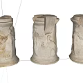 Ancient Broken Columns With Carved Reliefs Of Figures And Animals