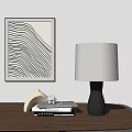 Black Ceramic Base White Fabric Shade Table Lamp On Wooden Table With Abstract Art