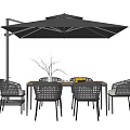 Stylish Outdoor Table with Wicker Chairs Black Umbrella and Fruit on Wooden Top