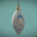 Silver Teardrop Shaped Jewelry Pendant With Carved Figure And Gold Top Accent