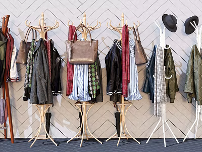 Stylish Clothes Hangers With Hanging Clothes Bags And Hats Against Geometric Patterned Wall 3d model