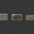 Natural Gray Textured Stones Arranged In Stacked Formation With Rough Surfaces