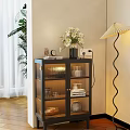 Stylish Glass Door Decorative Cabinet With Interior Books Candles White Flowers And Table Lamp