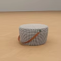 Black White Checkered Round Lazy Sofa With Brown Leather Handle On Light Wood Floor