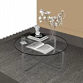 Modern Glass Top Coffee Table with Metal Frame Open Book Vase Statue on Rug