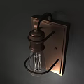 Industrial Style Wall Sconce with Metal Frame and Clear Glass Bulb Mounted on Dark Wall