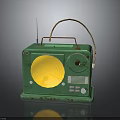 Vintage Green Electronic Radio With Yellow Speaker Antenna And Handle Design