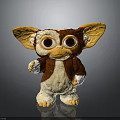 Cute Gremlin Character Toy With Large Ears Big Eyes Brown White Fur And Waving Hand