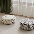 Two Round Fabric Poufs With Black And White Patterns On Indoor Carpet 3d model