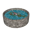 Circular Stone Wall Water Fountain With Lily Pads Lotus Flowers And Aquatic Plants