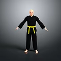 Bald Man In Black Karate Uniform With Yellow Belt Standing Arms Outstretched On Gray Background